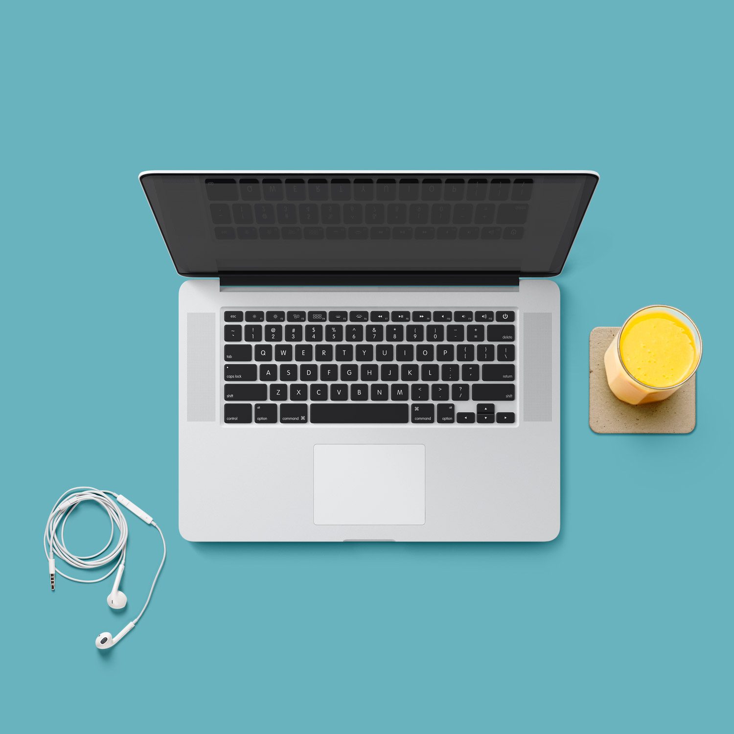 A laptop and headphones on top of a table.