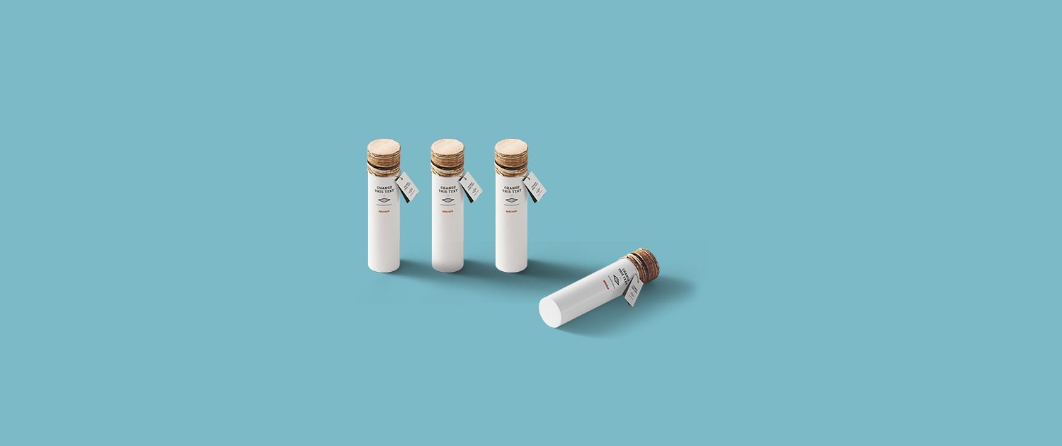 A group of four white bottles with brown lids.