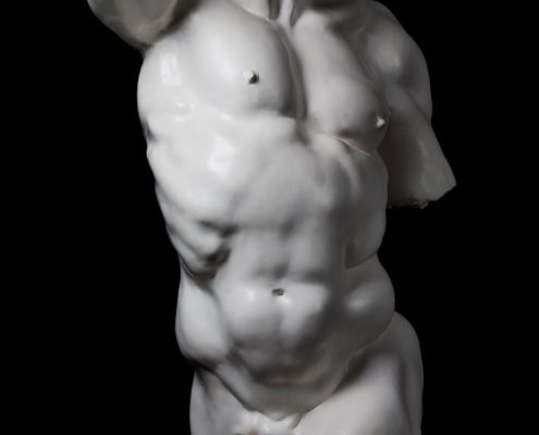 A statue of a man with no shirt on.