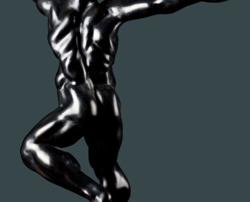 A silver man is standing in the air