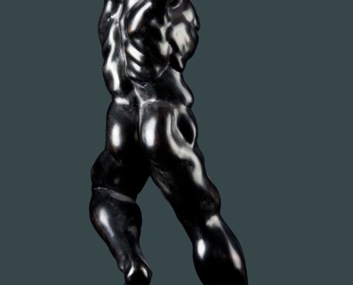 A black and silver statue of a man.