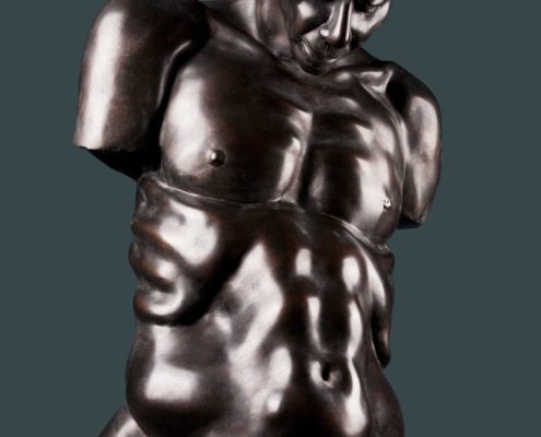 A statue of a man with no shirt and no shirt.