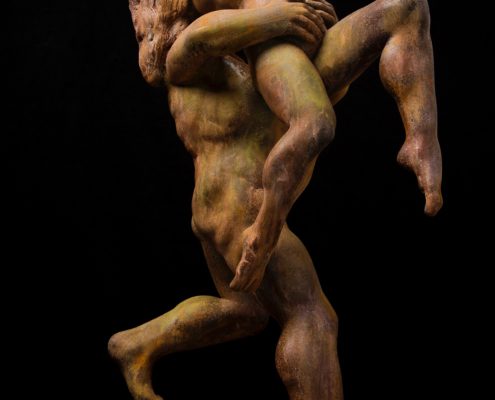 A statue of two people holding each other.