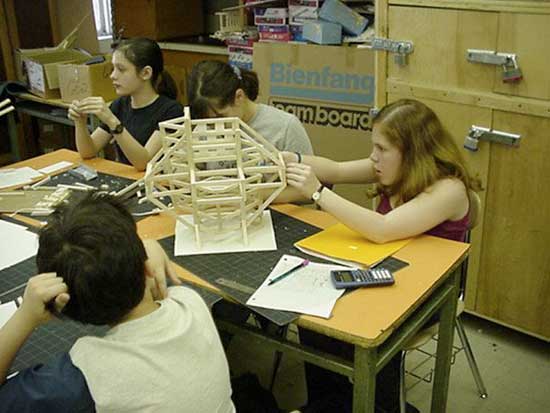 A group of people sitting around a table.