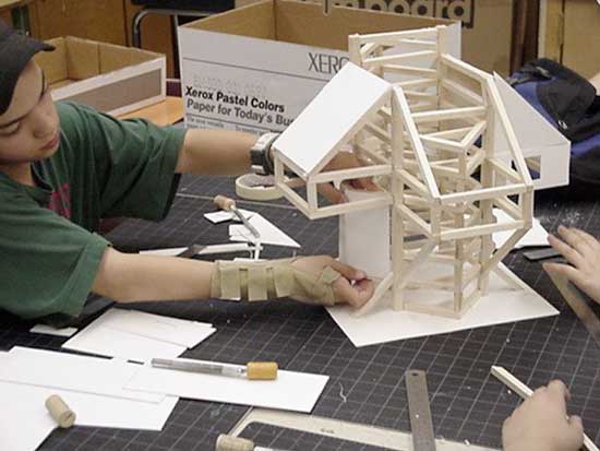 A person working on some building blocks