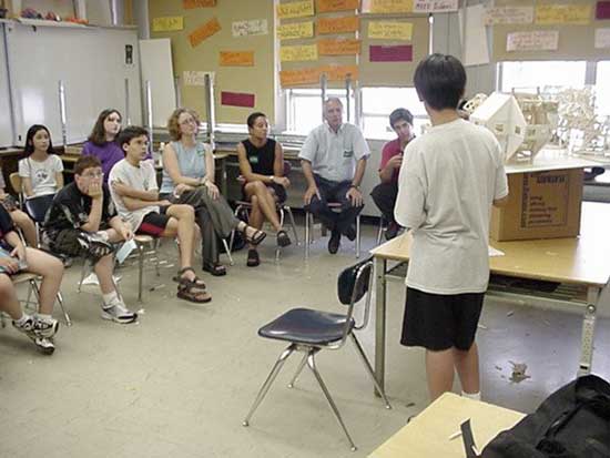 A group of people sitting in a room.