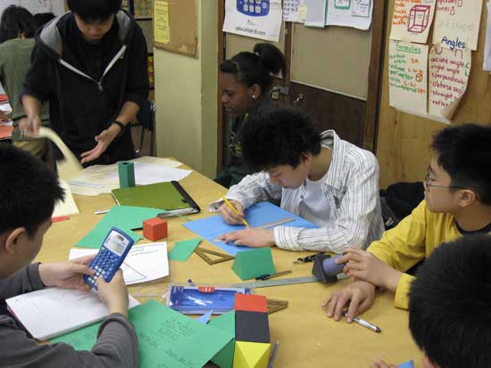 A group of people sitting around a table.