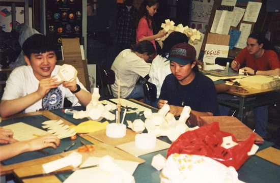 A group of people sitting around a table.