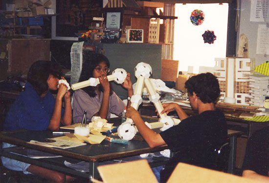 A group of people sitting around a table.