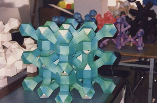 A close up of some blue paper sculptures