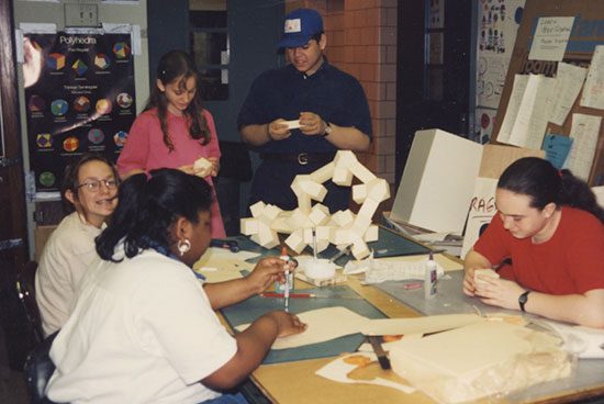 A group of people sitting around a table.