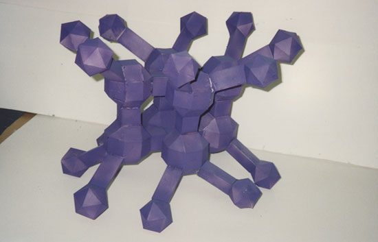 A purple paper sculpture of a molecule.