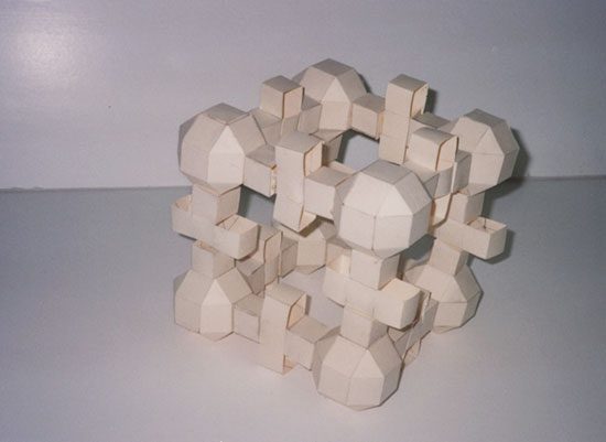 A wooden puzzle sitting on top of a table.