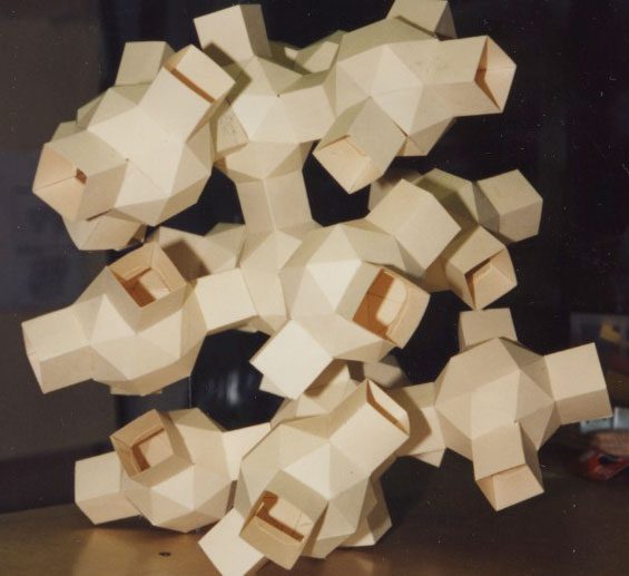 A wooden sculpture of a bunch of blocks