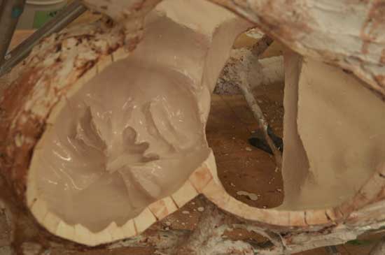 A close up of the inside of a wooden bowl.