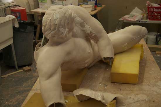 A statue of an angel is being made.